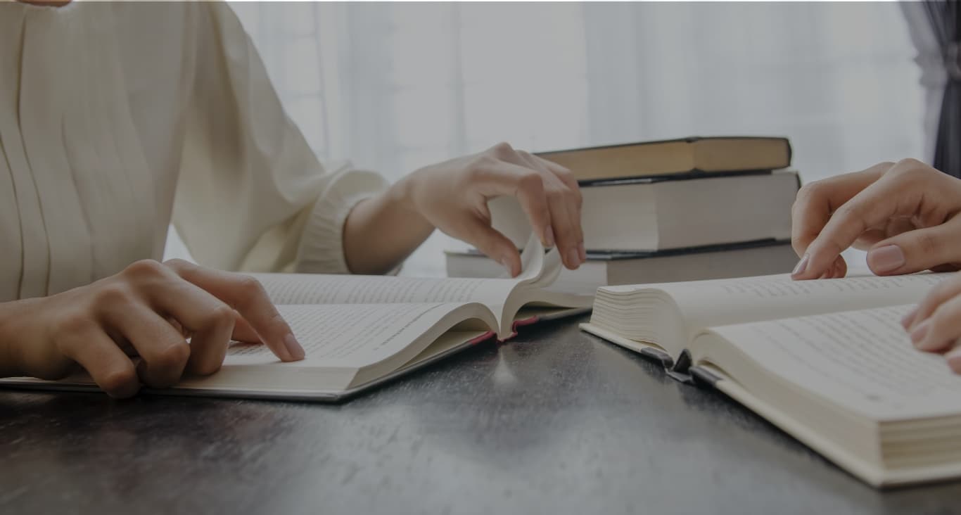 Person turning age of book